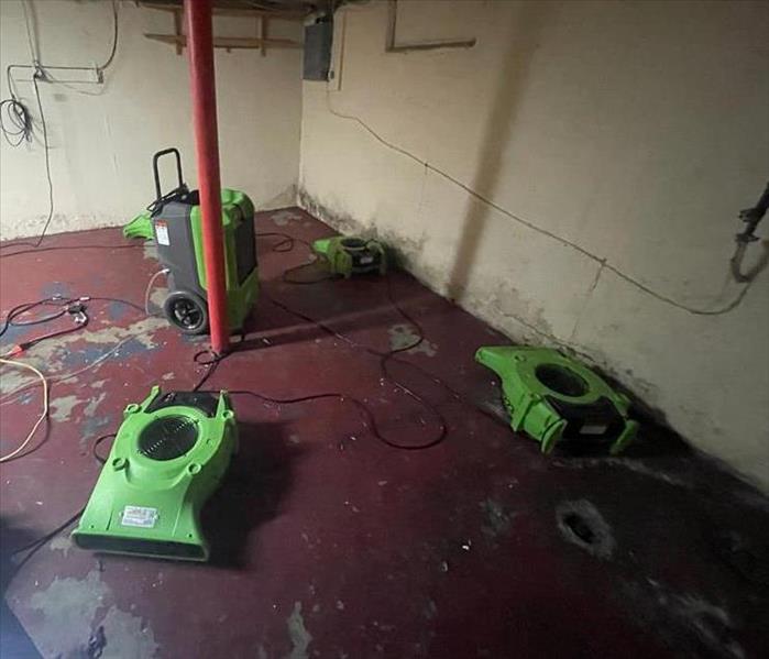 SERVPRO air movers and dehumidifiers dry the remaining moisture in the basement
