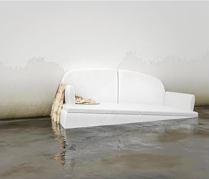 White sofa floating in flooded living room